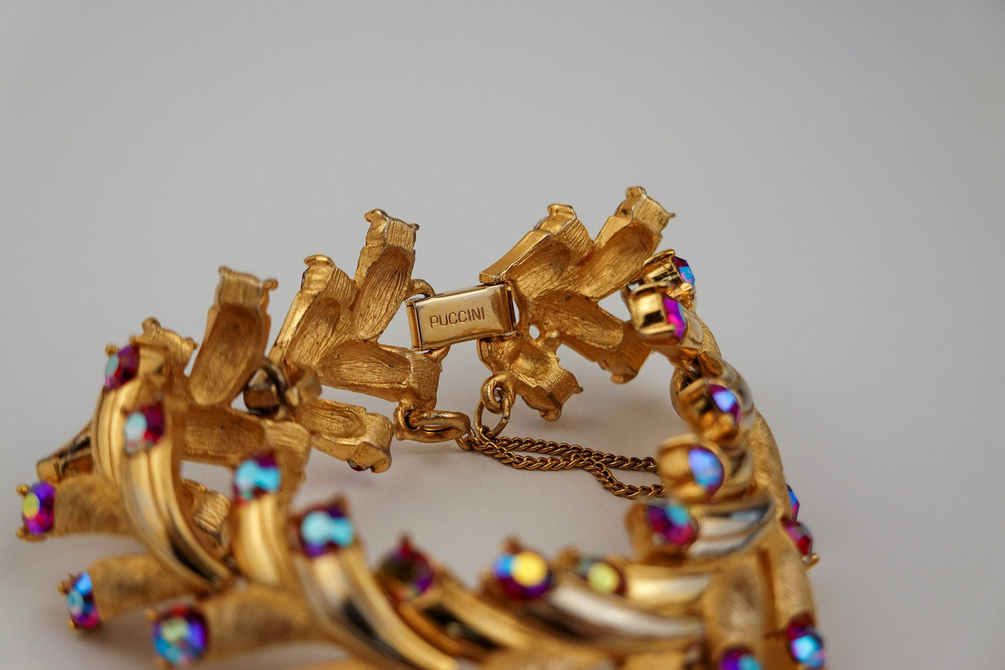 Vintage Puccini Raspberry Aurora Borealis Rhinestone Bracelet - Gold Tone Articulated Fancy Link, Leaf Motif - Mid-Century Bracelet
