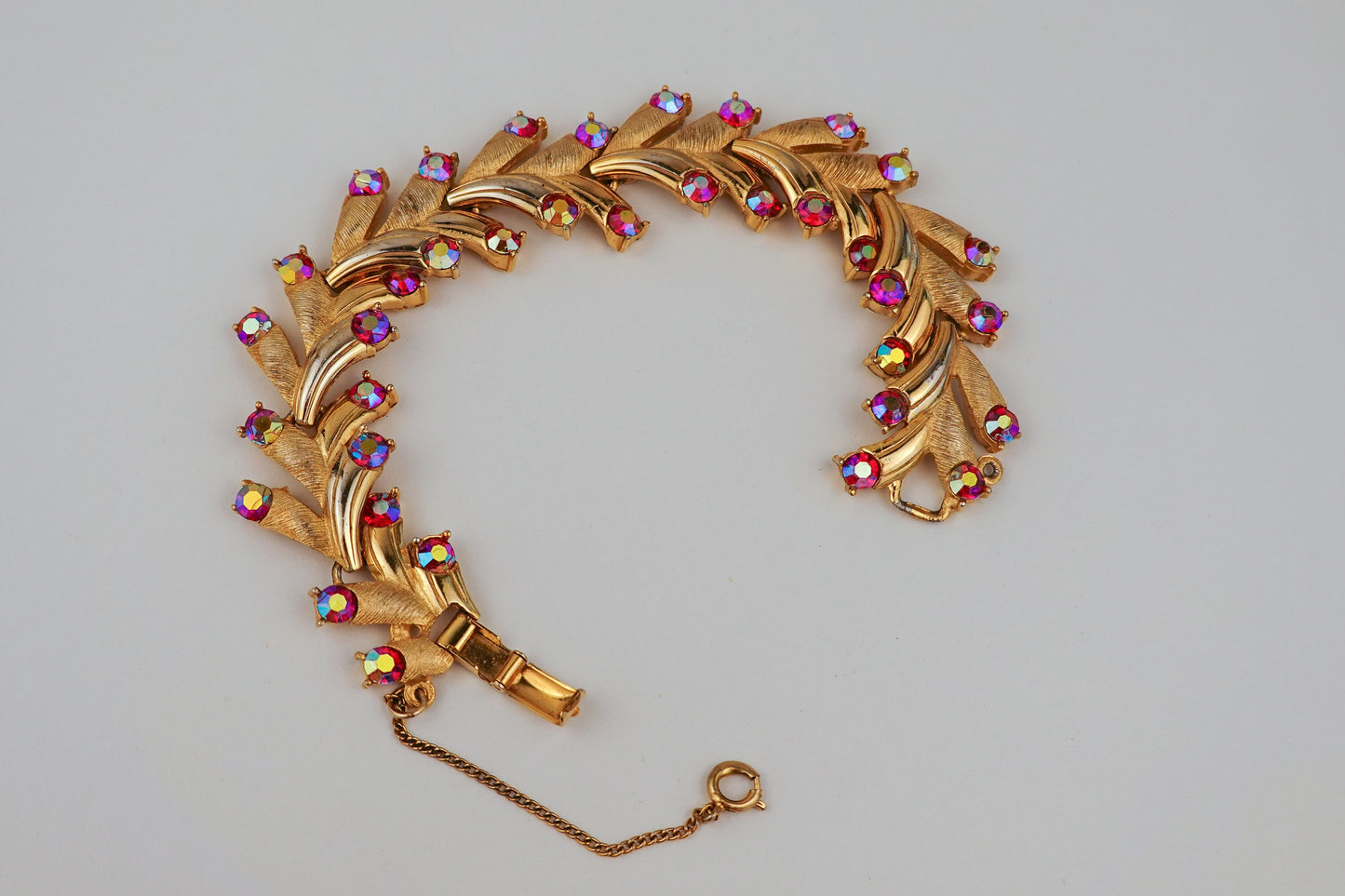 Vintage Puccini Raspberry Aurora Borealis Rhinestone Bracelet - Gold Tone Articulated Fancy Link, Leaf Motif - Mid-Century Bracelet