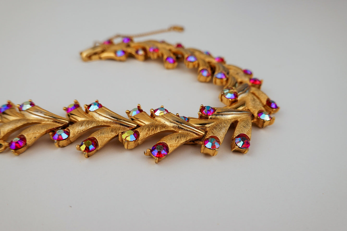 Vintage Puccini Raspberry Aurora Borealis Rhinestone Bracelet - Gold Tone Articulated Fancy Link, Leaf Motif - Mid-Century Bracelet